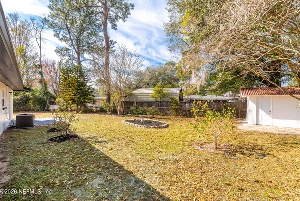 a view of a yard with trees
