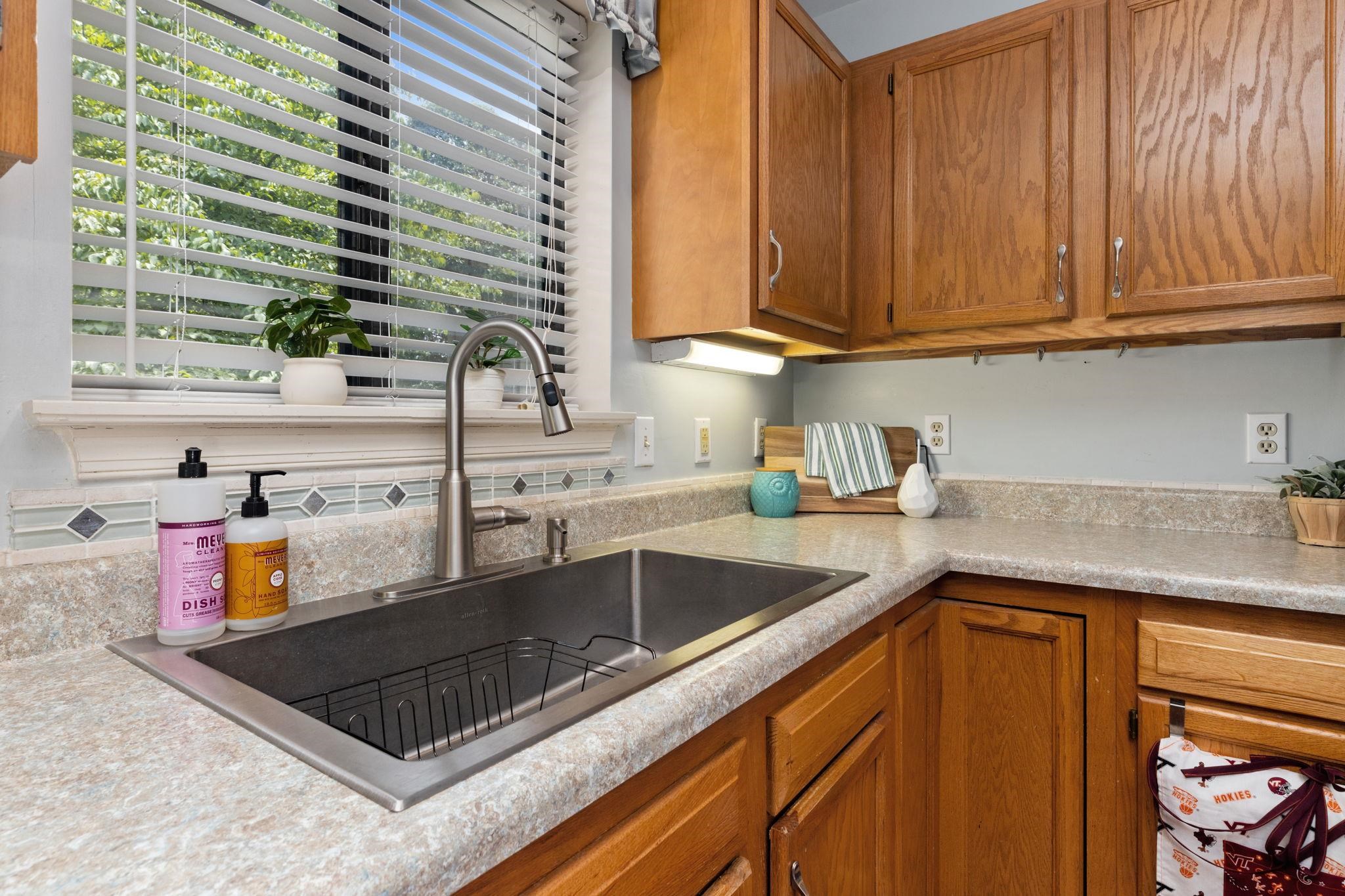 1037 Amber Ridge Road Charlottesville, VA 22901 - Photo 11 of 39 a kitchen with stainless steel appliances granite countertop a sink stove and cabinets