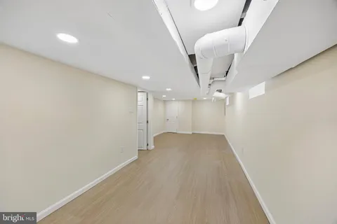 a view of a big room with a ceiling fan