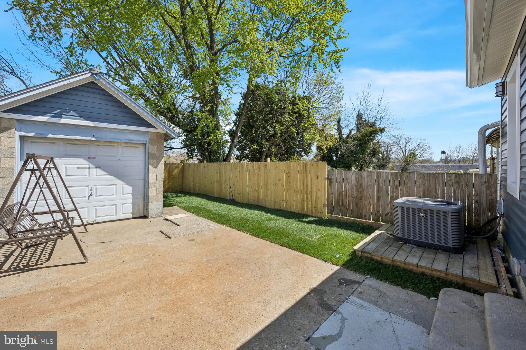 1051 Springfield Road Darby, PA 19023 - Photo 23 of 24 a backyard of a house with table and chairs