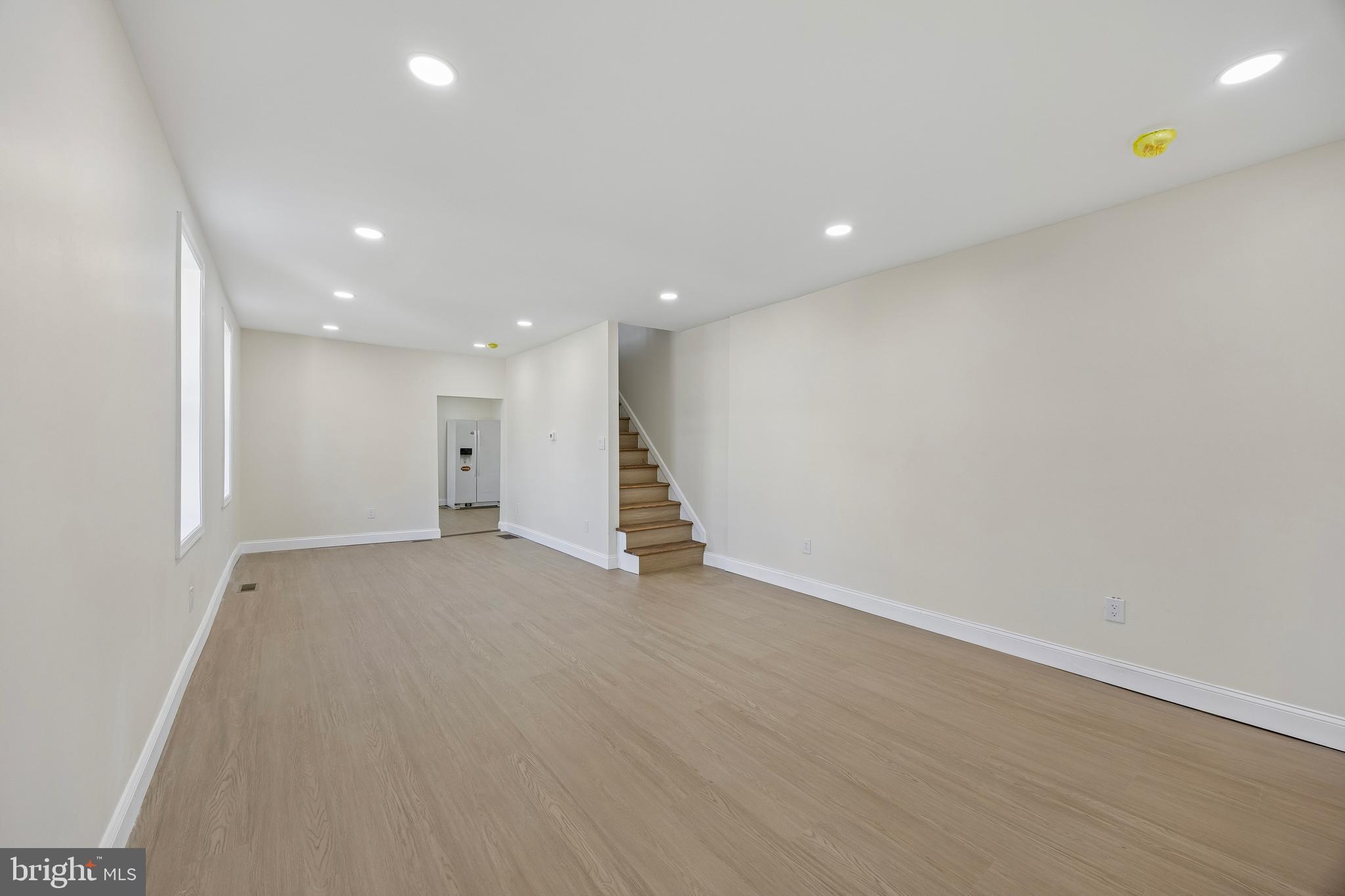 1051 Springfield Road Darby, PA 19023 - Photo 4 of 24 a view of an empty room with wooden floor