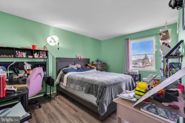 a bed room with a bed and a lamp