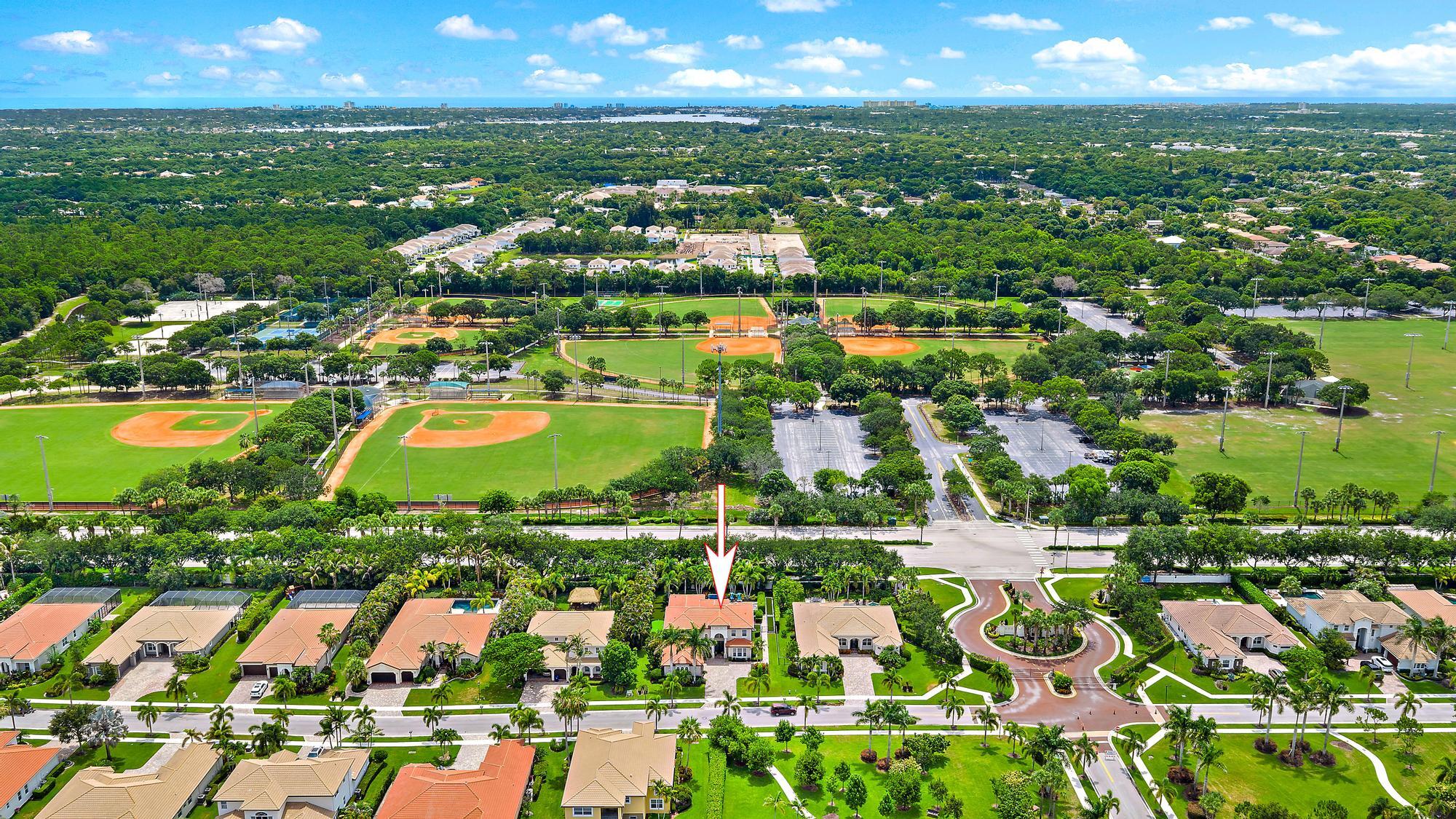 283 Rudder Cay Way Jupiter, FL 33458 - Photo 25 of 41 an aerial view of residential houses with outdoor space and lake view