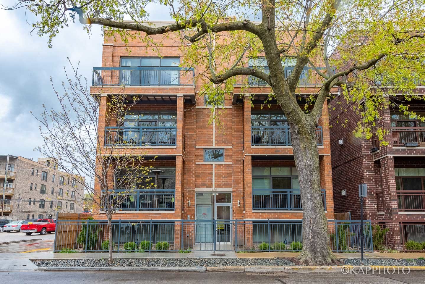 1430 West Fillmore Street, Unit 2W Chicago, IL 60607 - Photo 1 of 27 front view of a building with a street