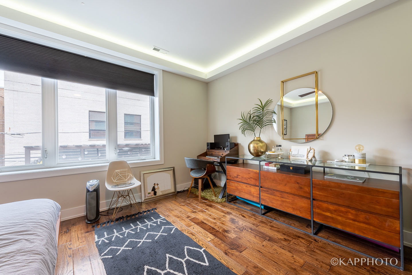 1430 West Fillmore Street, Unit 2W Chicago, IL 60607 - Photo 14 of 27 a living room with furniture a mirror and a large window