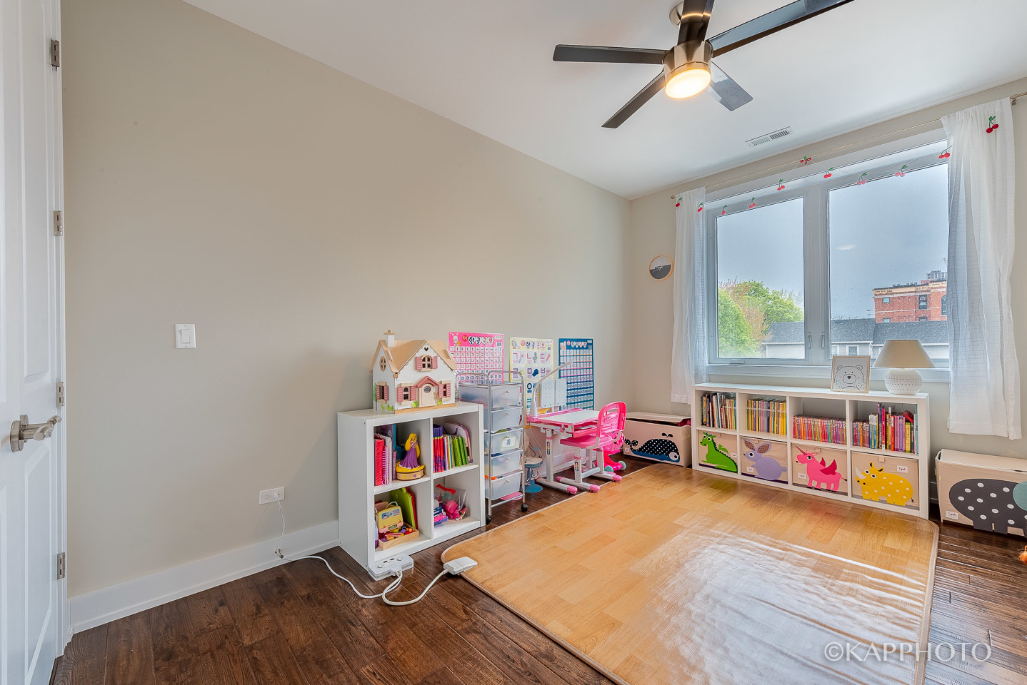 1430 West Fillmore Street, Unit 2W Chicago, IL 60607 - Photo 16 of 27 a children room with toys and a wooden floor