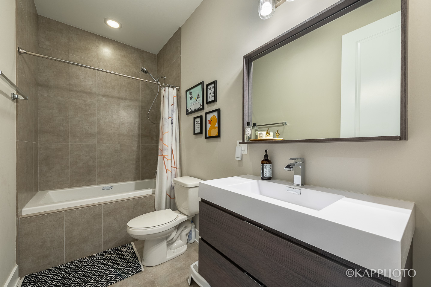 1430 West Fillmore Street, Unit 2W Chicago, IL 60607 - Photo 22 of 27 a bathroom with a sink a toilet and shower