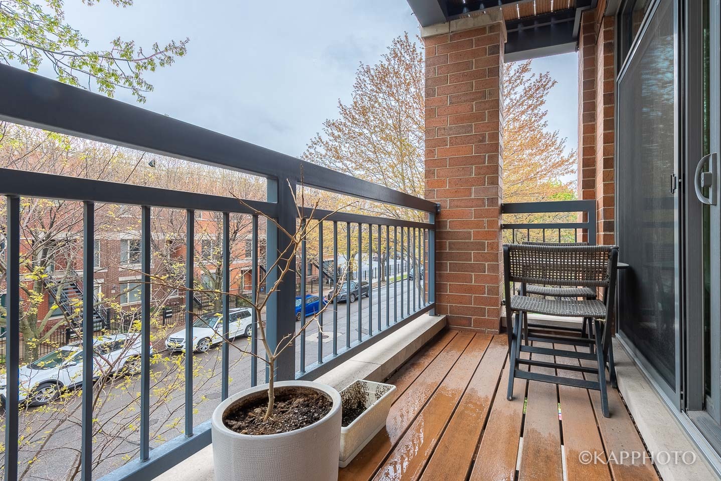 1430 West Fillmore Street, Unit 2W Chicago, IL 60607 - Photo 27 of 27 a view of a balcony with chair and glass door
