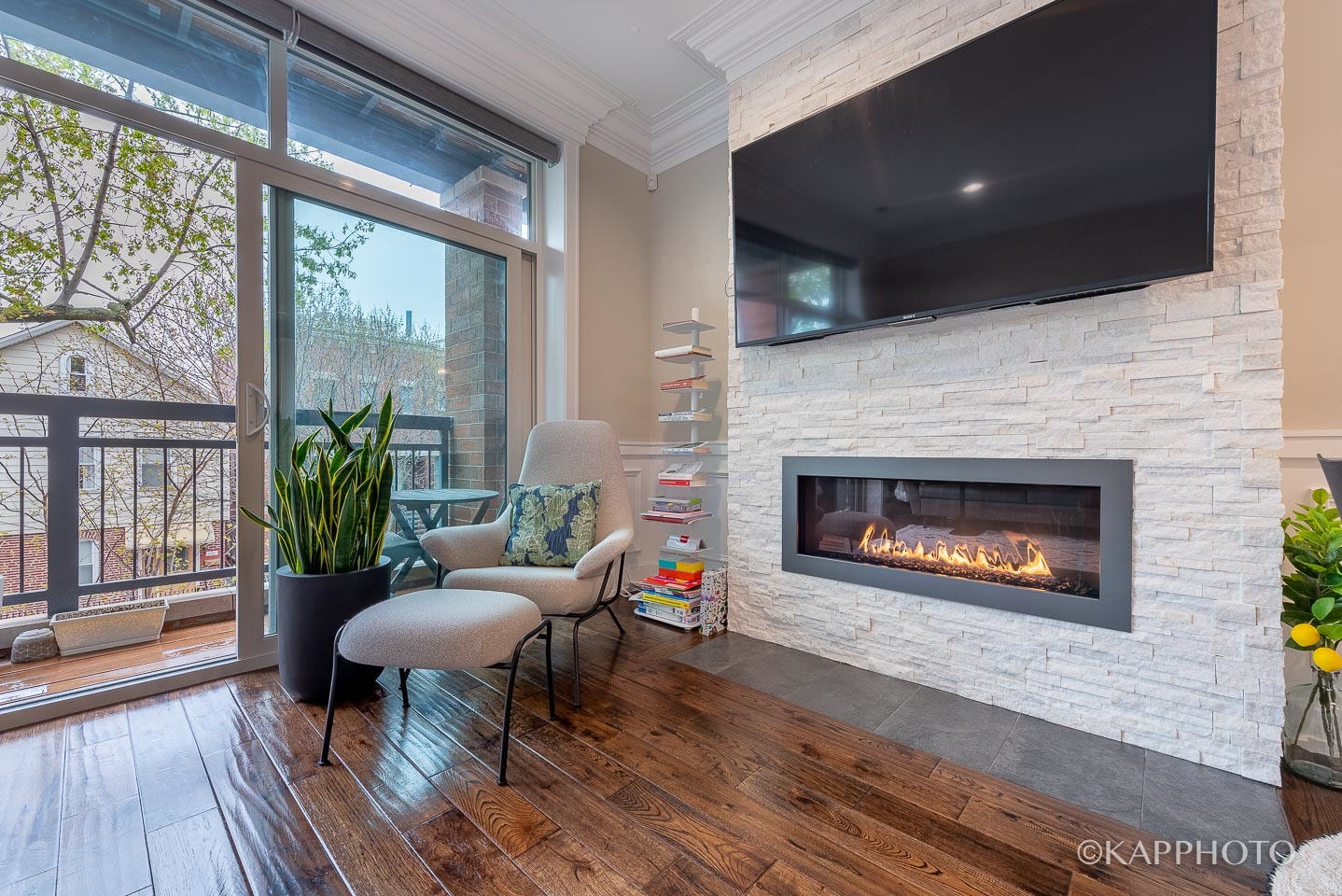 1430 West Fillmore Street, Unit 2W Chicago, IL 60607 - Photo 5 of 27 a living room with furniture and a fireplace
