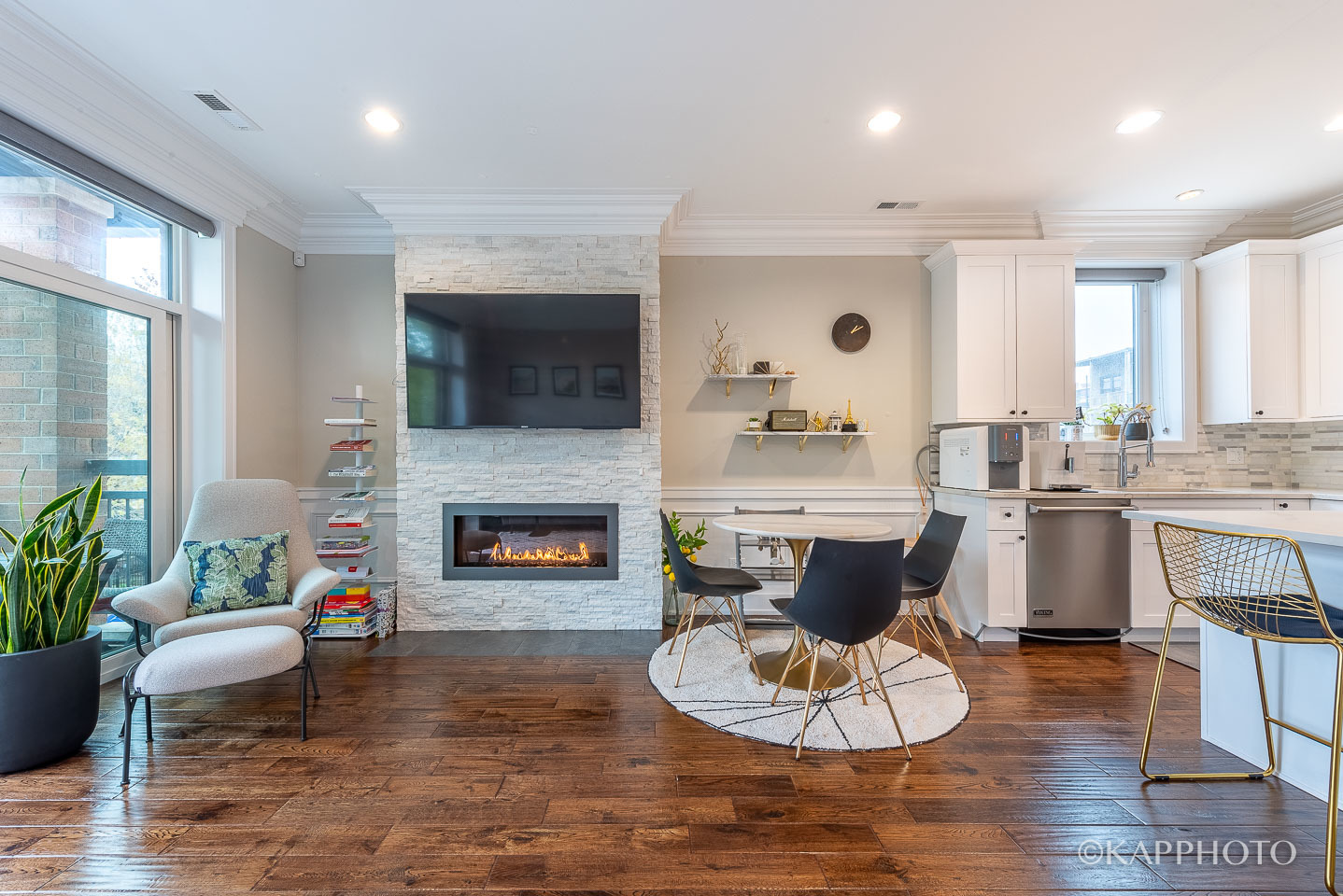 1430 West Fillmore Street, Unit 2W Chicago, IL 60607 - Photo 6 of 27 a living room with furniture a fireplace and a flat screen tv
