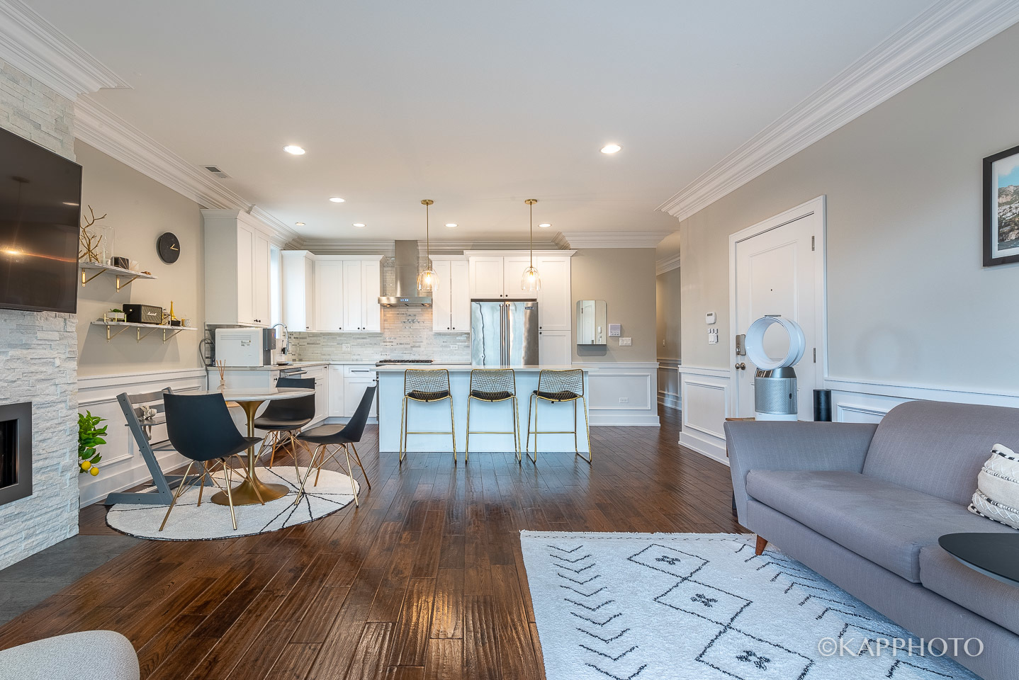 1430 West Fillmore Street, Unit 2W Chicago, IL 60607 - Photo 7 of 27 a living room with kitchen island furniture and a wooden floor