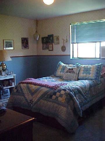 14040 Rutherford Road Yakima, WA 98903 - Photo 5 of 7 a bedroom with a bed and window