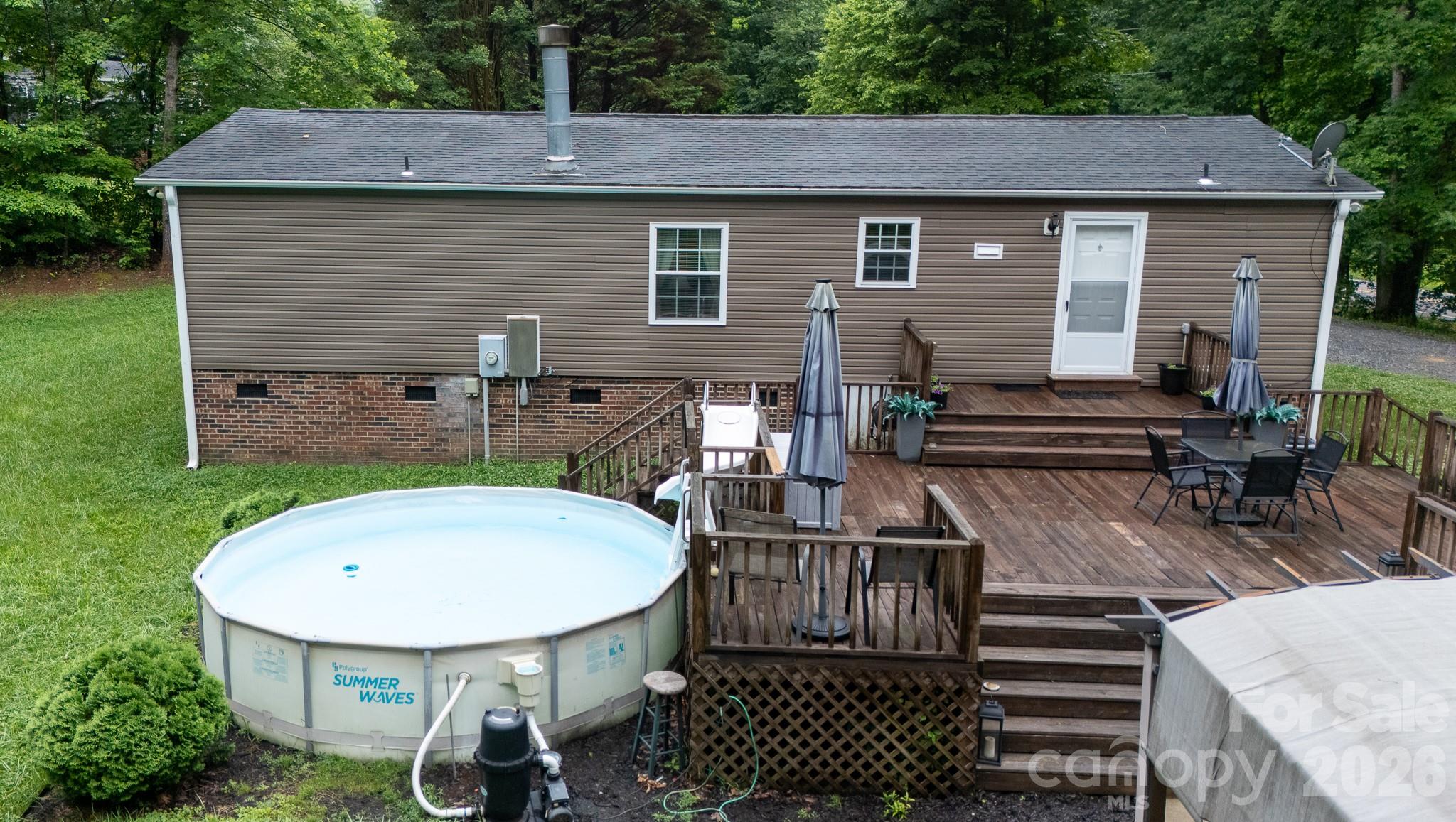 652 Sutton Spring Road York, SC 29745 - Photo 28 of 28 a backyard of a house with table and chairs