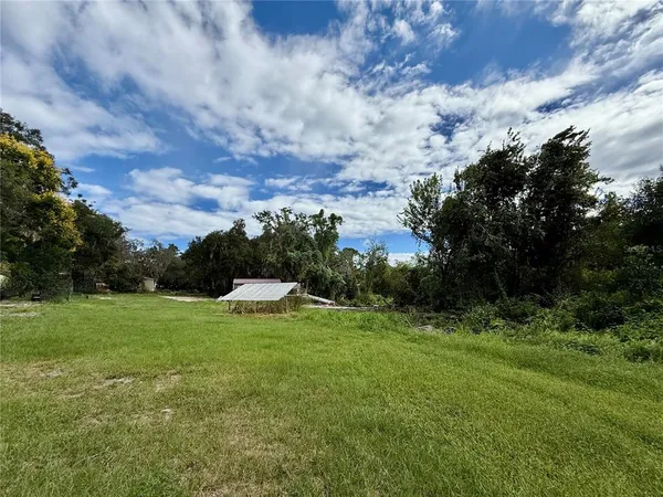 a view of a golf course with green space