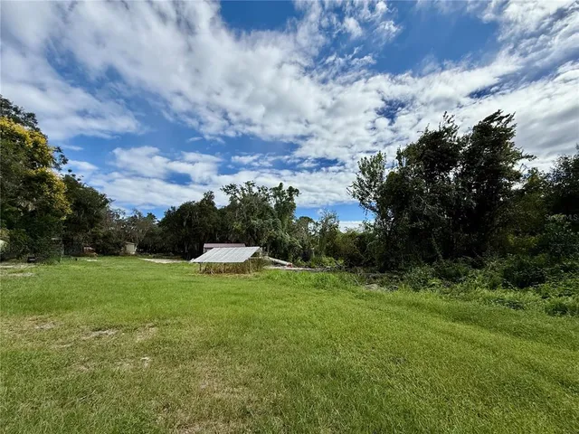 a view of a golf course with green space