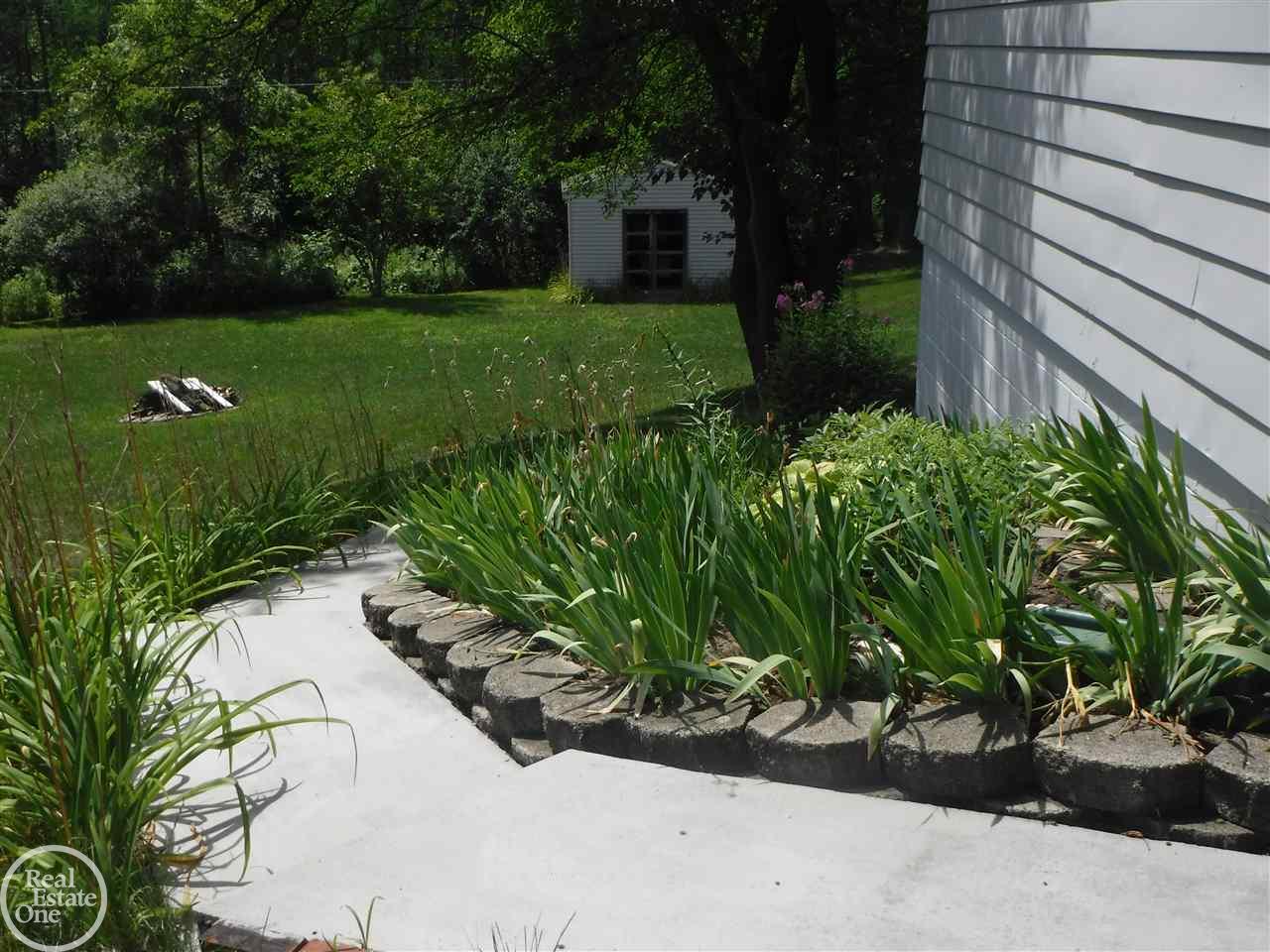 4585 Rattek Road Clarkston, MI 48346 - Photo 38 of 41 Lovely walk way to lower
