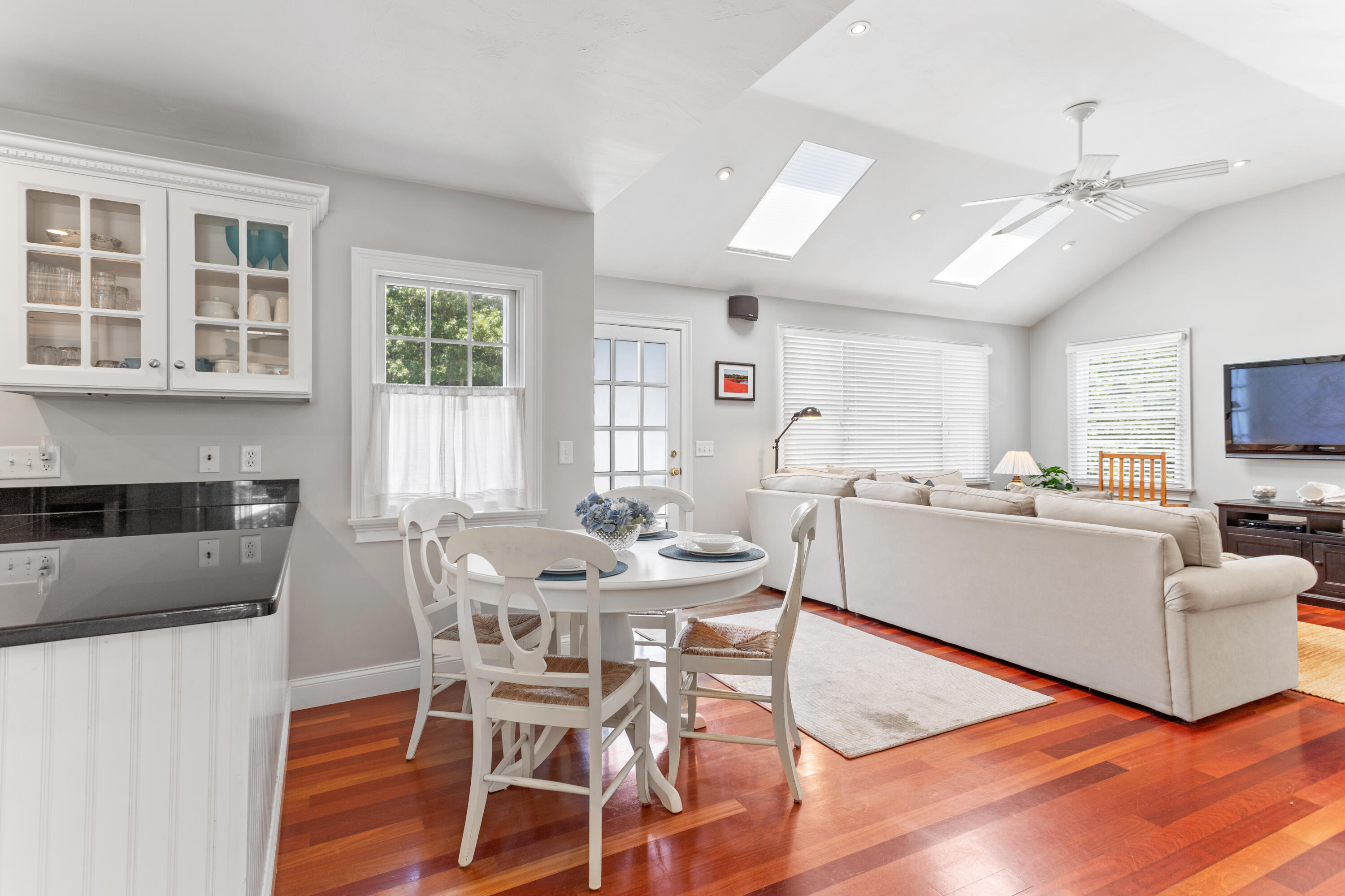 13 Johnny Cake Road Centerville, MA 02632 - Photo 11 of 40 a view of a dining room with furniture and wooden floor