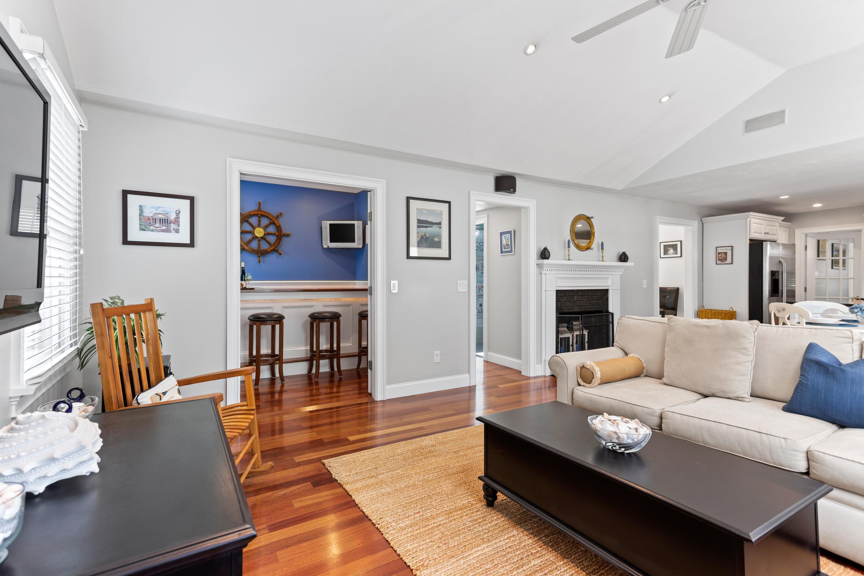 13 Johnny Cake Road Centerville, MA 02632 - Photo 22 of 40 a living room with furniture a fireplace and a flat screen tv