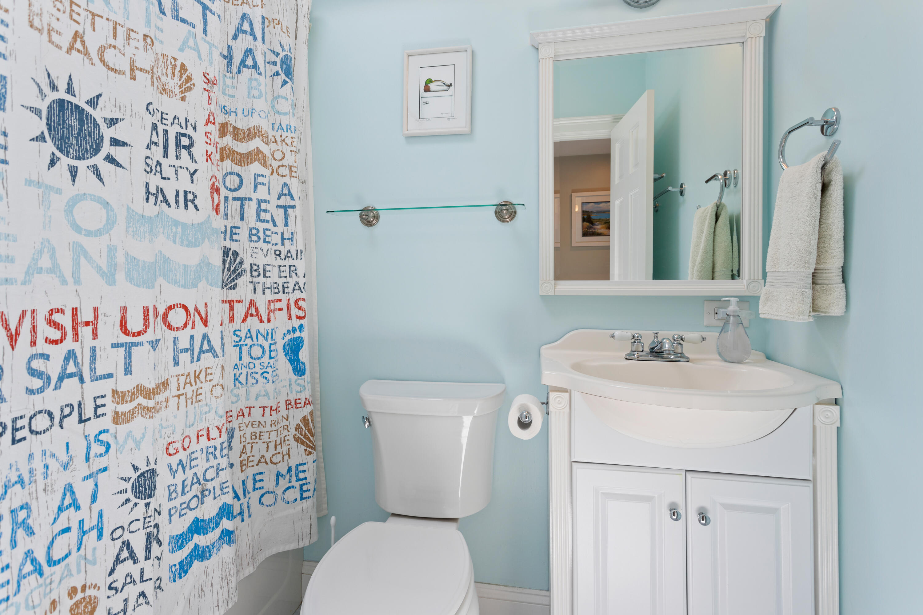 13 Johnny Cake Road Centerville, MA 02632 - Photo 23 of 40 a bathroom with a sink toilet and a mirror