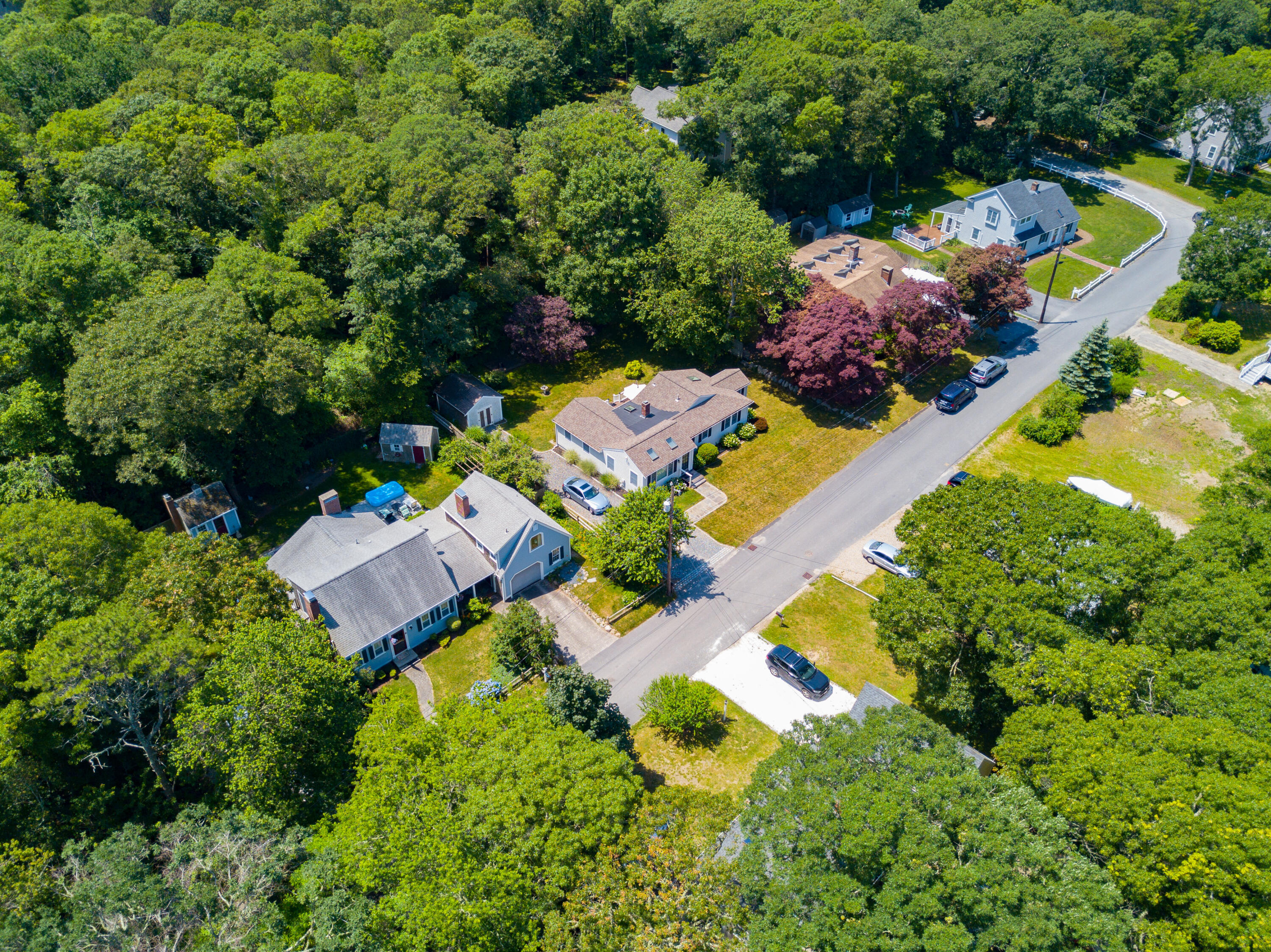 13 Johnny Cake Road Centerville, MA 02632 - Photo 5 of 40 an aerial view of a house with a yard and swimming pool