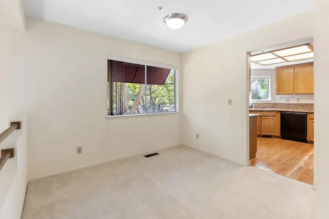 an empty room with windows and closet