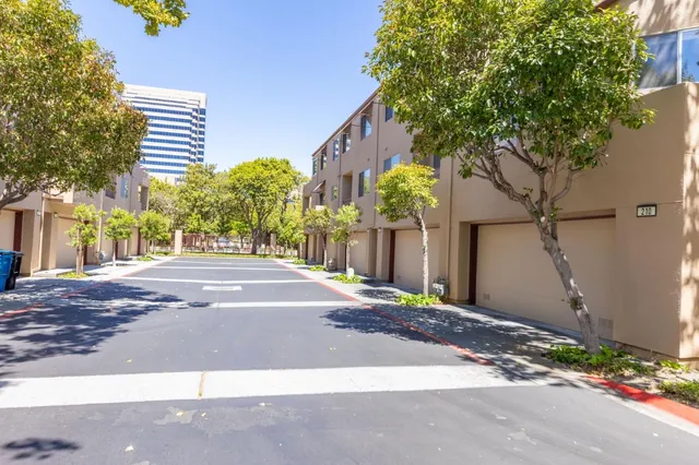a view of street along with house and trees