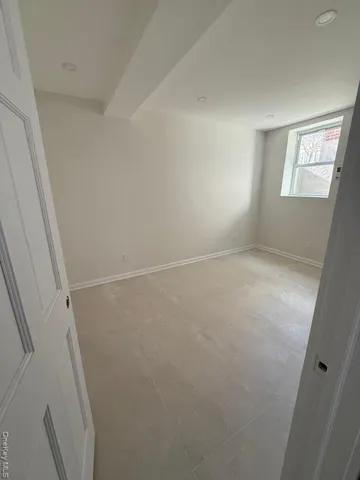 a view of an empty room with windows