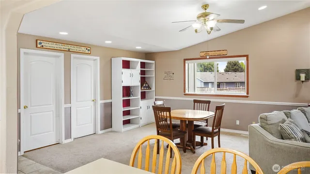 a view of a dining room with furniture and window