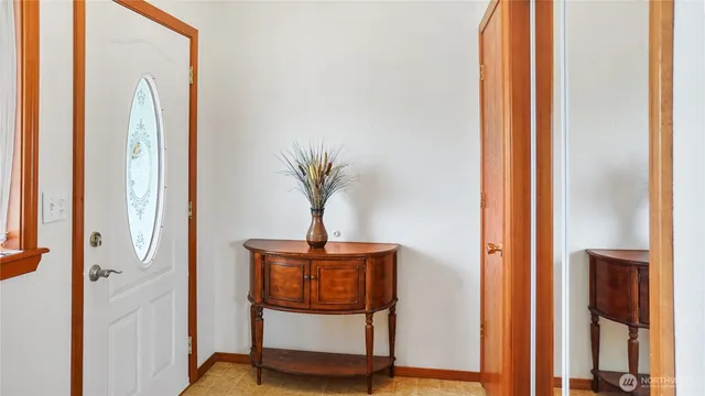 a view of a backyard with table and chairs and wooden fence