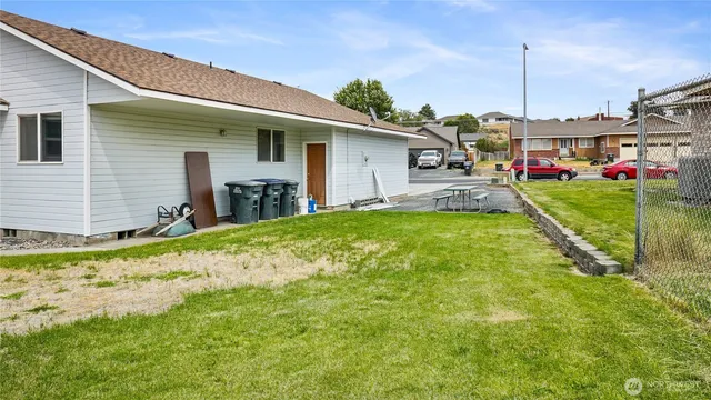 a front view of a house with a yard fountain