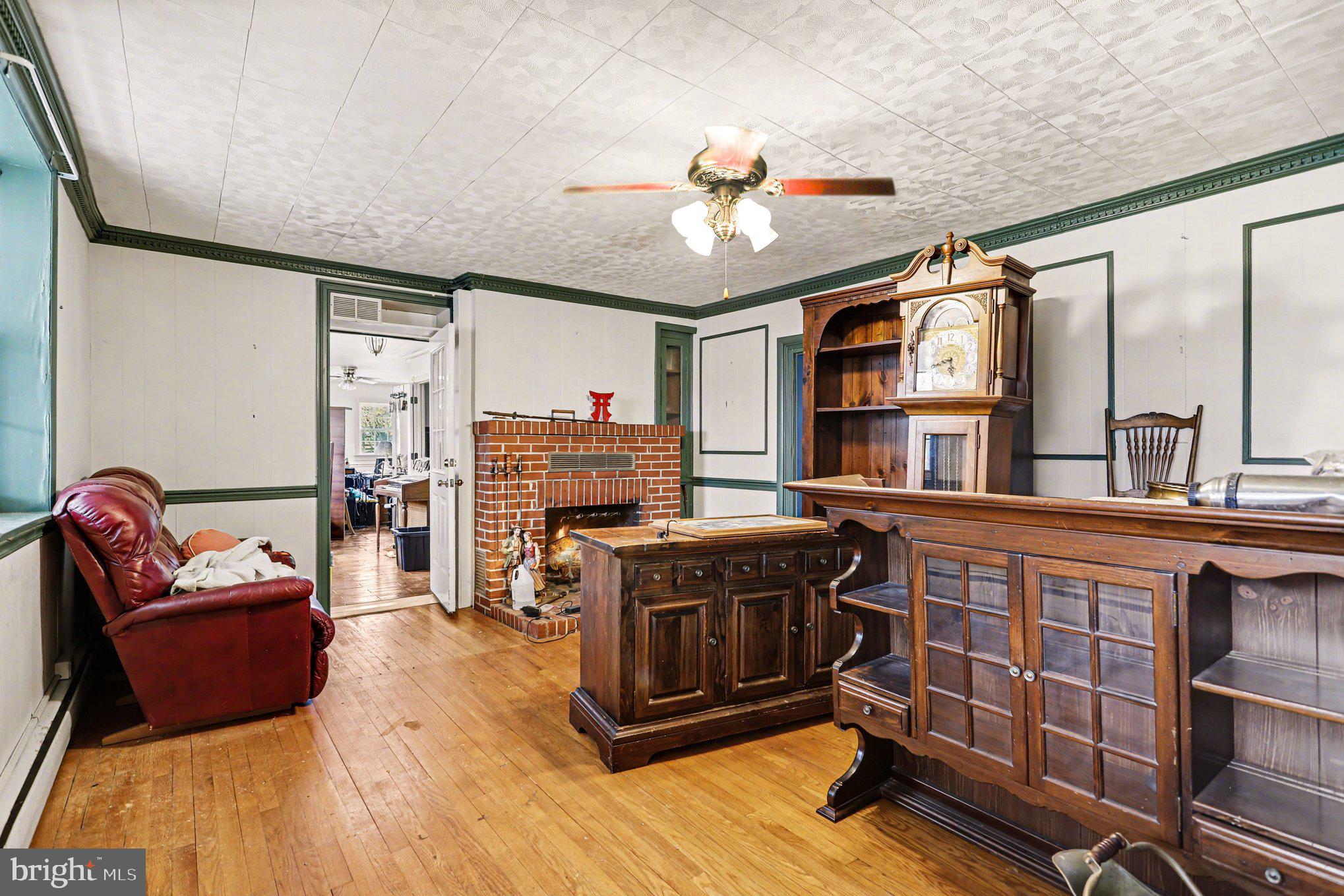 10301 Mckinstry Mill Road New Windsor, MD 21776 - Photo 6 of 43 Living room with fireplace.
