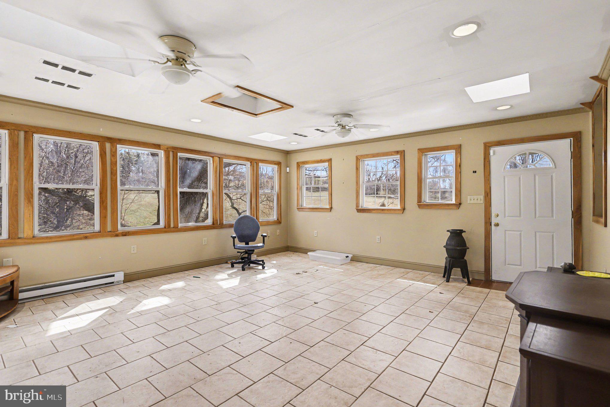 10301 Mckinstry Mill Road New Windsor, MD 21776 - Photo 9 of 43 Sunroom off the kitchen