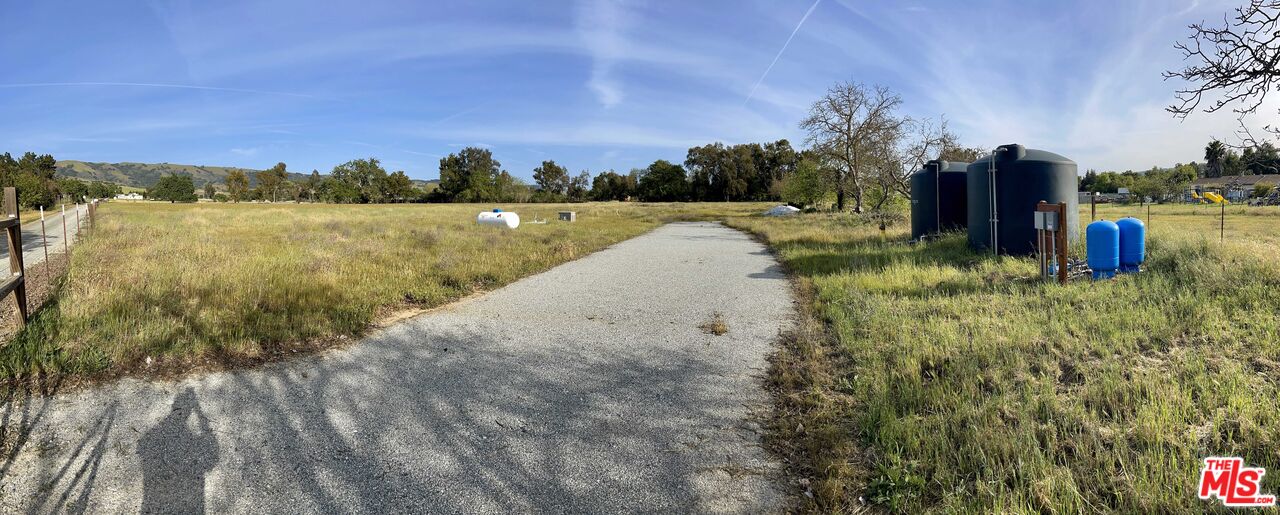 2590 Roop Road Gilroy, CA 95020 - Photo 3 of 27 a view of a lake with houses in the background