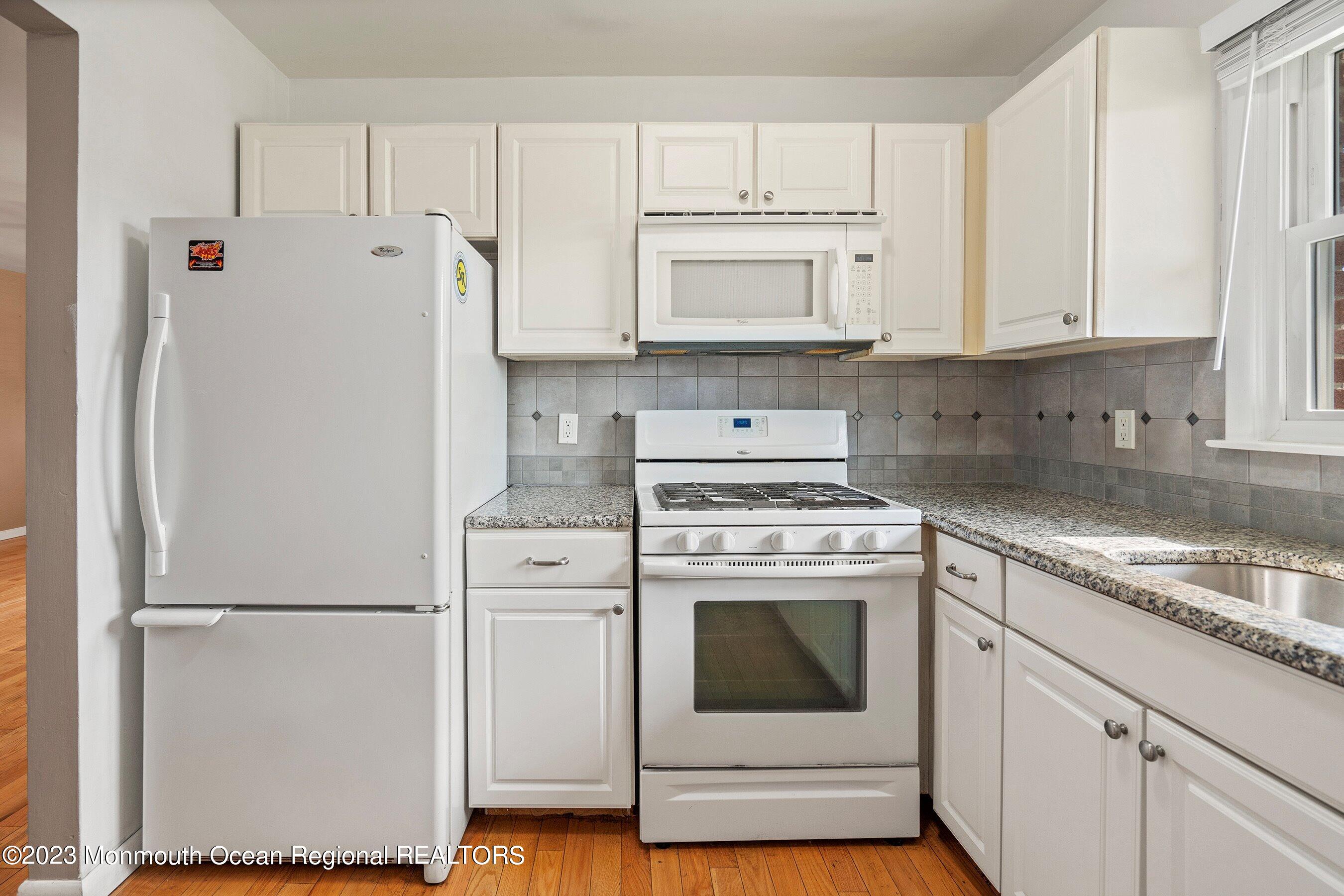 16 B Magnolia Road, Unit 1A Manahawkin, NJ 08050 - Photo 14 of 21 a white refrigerator freezer sitting inside of a kitchen