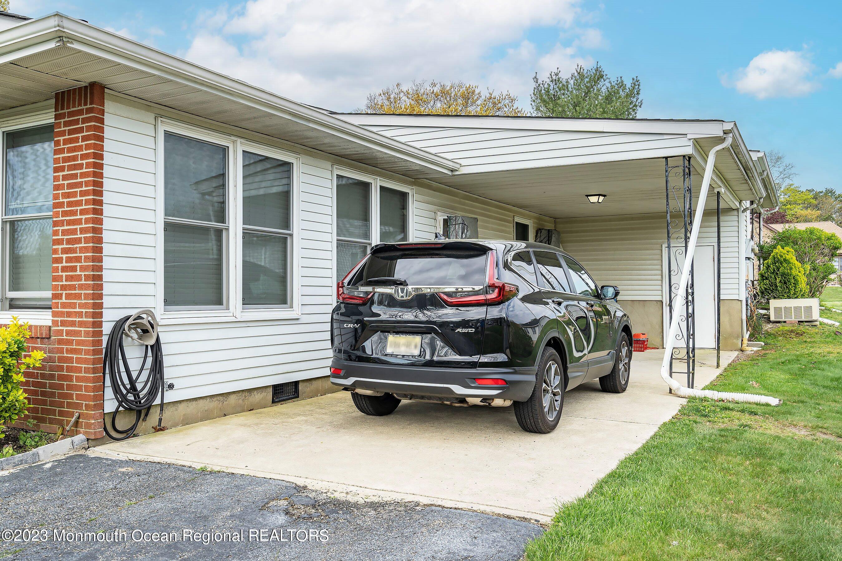 16 B Magnolia Road, Unit 1A Manahawkin, NJ 08050 - Photo 5 of 21 a car parked in front of a house