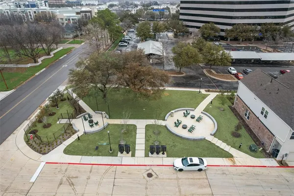 a kitchen with a sink center island and stainless steel appliances