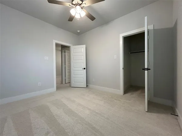 a view of lobby with stairs and a chandelier