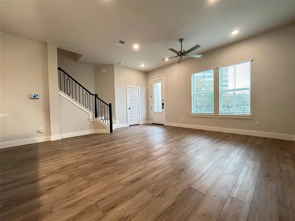 a kitchen with stainless steel appliances granite countertop a sink a stove and microwave