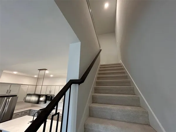 a bathroom with a shower sink and mirror