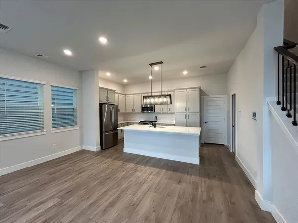 a bathroom with a sink vanity and mirror
