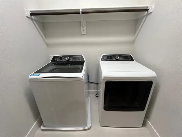 a view of hallway with bathroom