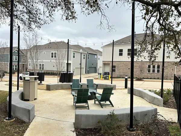 a large kitchen with stainless steel appliances granite countertop a sink a stove and a wooden floors