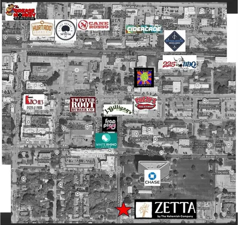 a kitchen with stainless steel appliances kitchen island a sink dishwasher a refrigerator and a large mirror with wooden floor