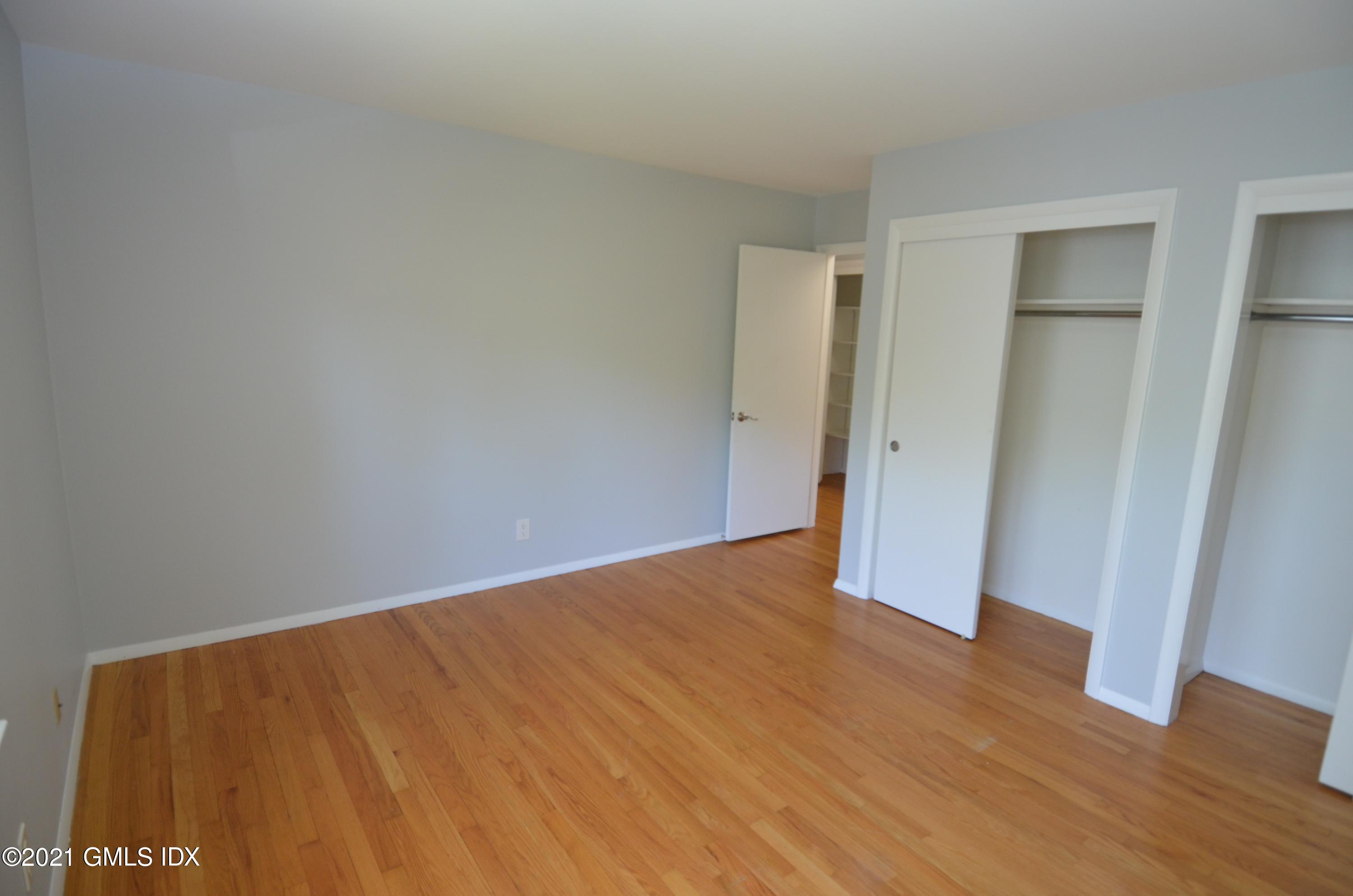 5 Ridge Place, Unit 1 Greenwich, CT 06831 - Photo 14 of 29 a view of an empty room with wooden floor