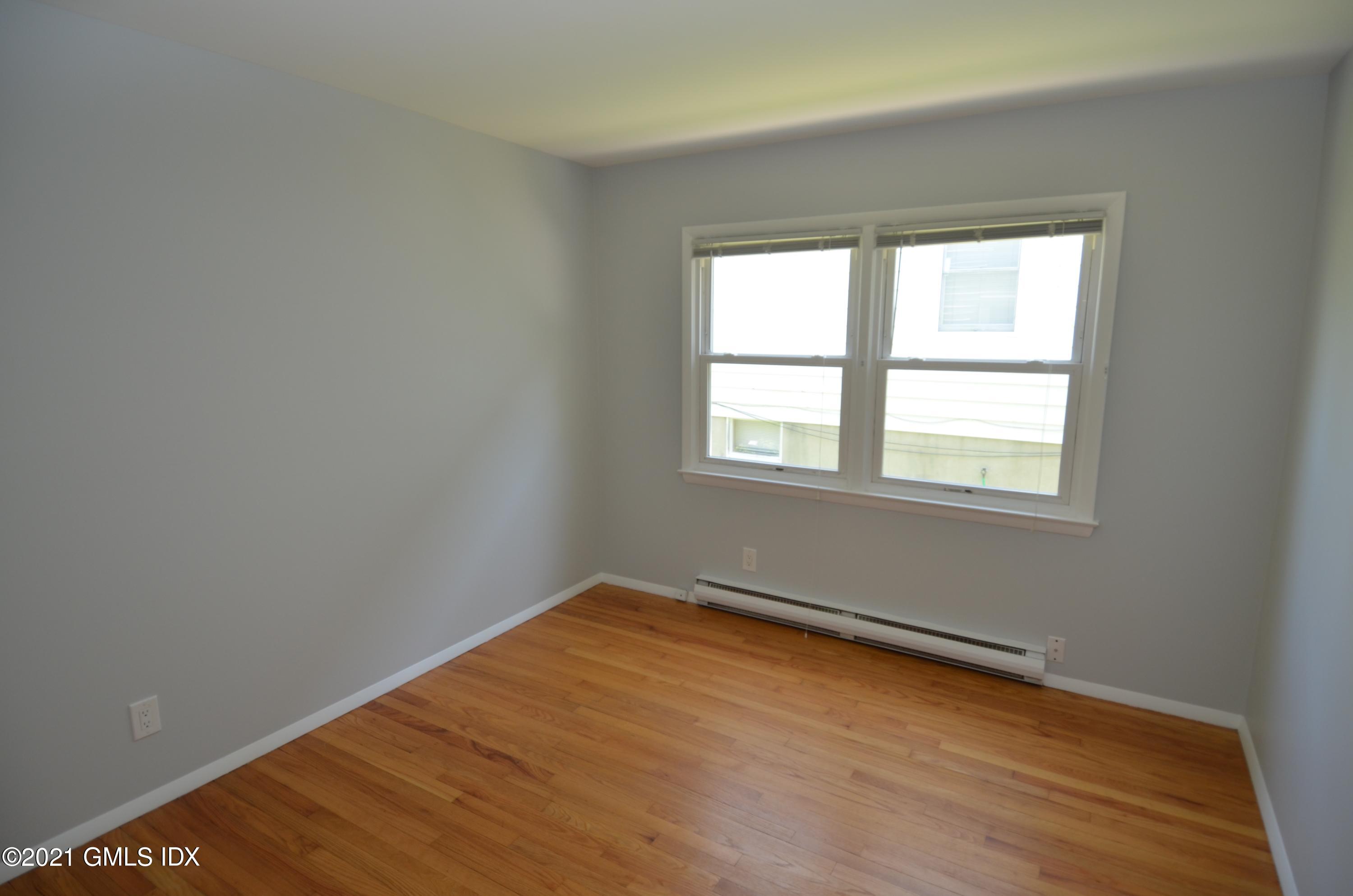 5 Ridge Place, Unit 1 Greenwich, CT 06831 - Photo 15 of 29 an empty room with a window