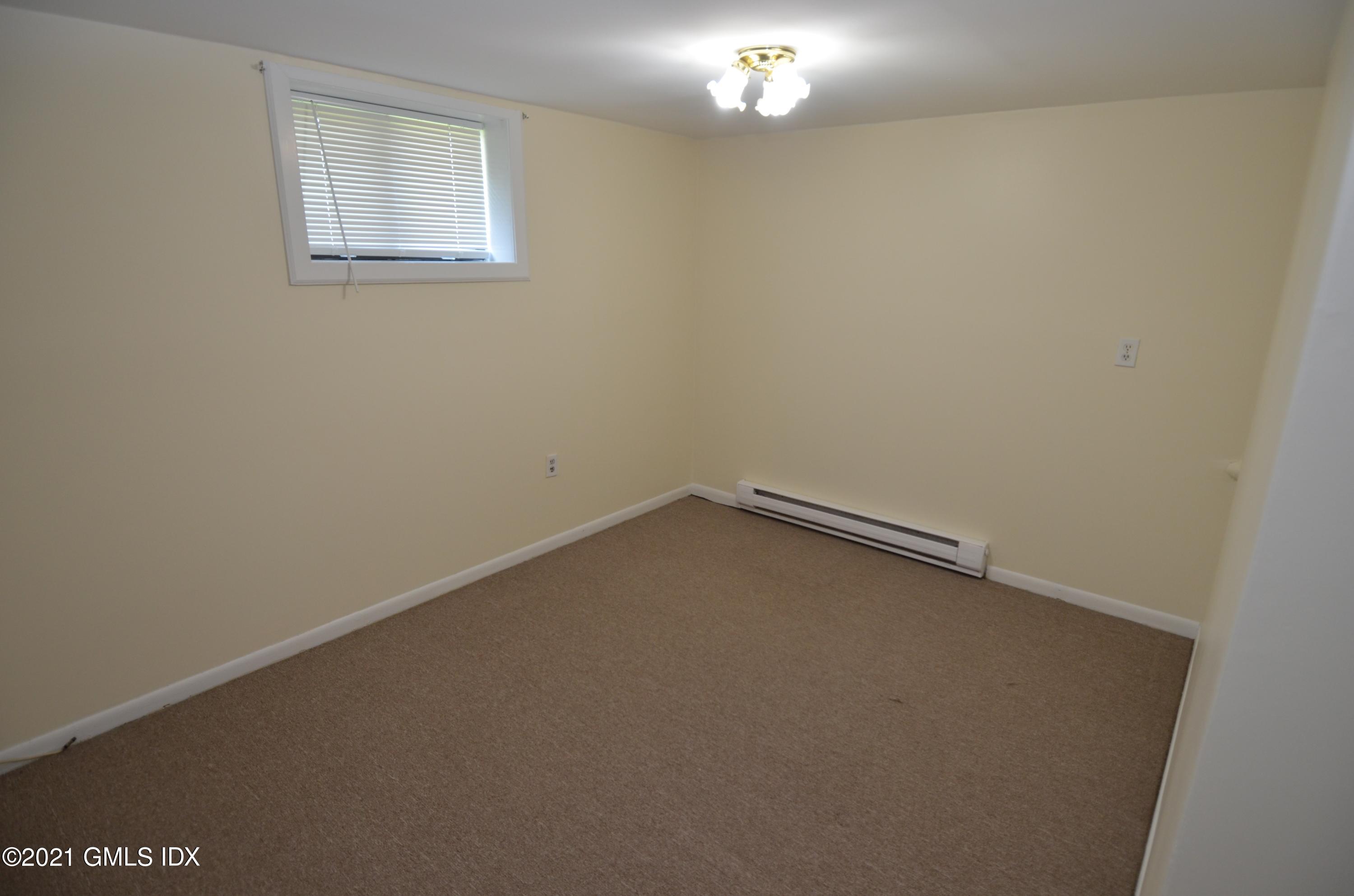 5 Ridge Place, Unit 1 Greenwich, CT 06831 - Photo 20 of 29 an empty room with a window