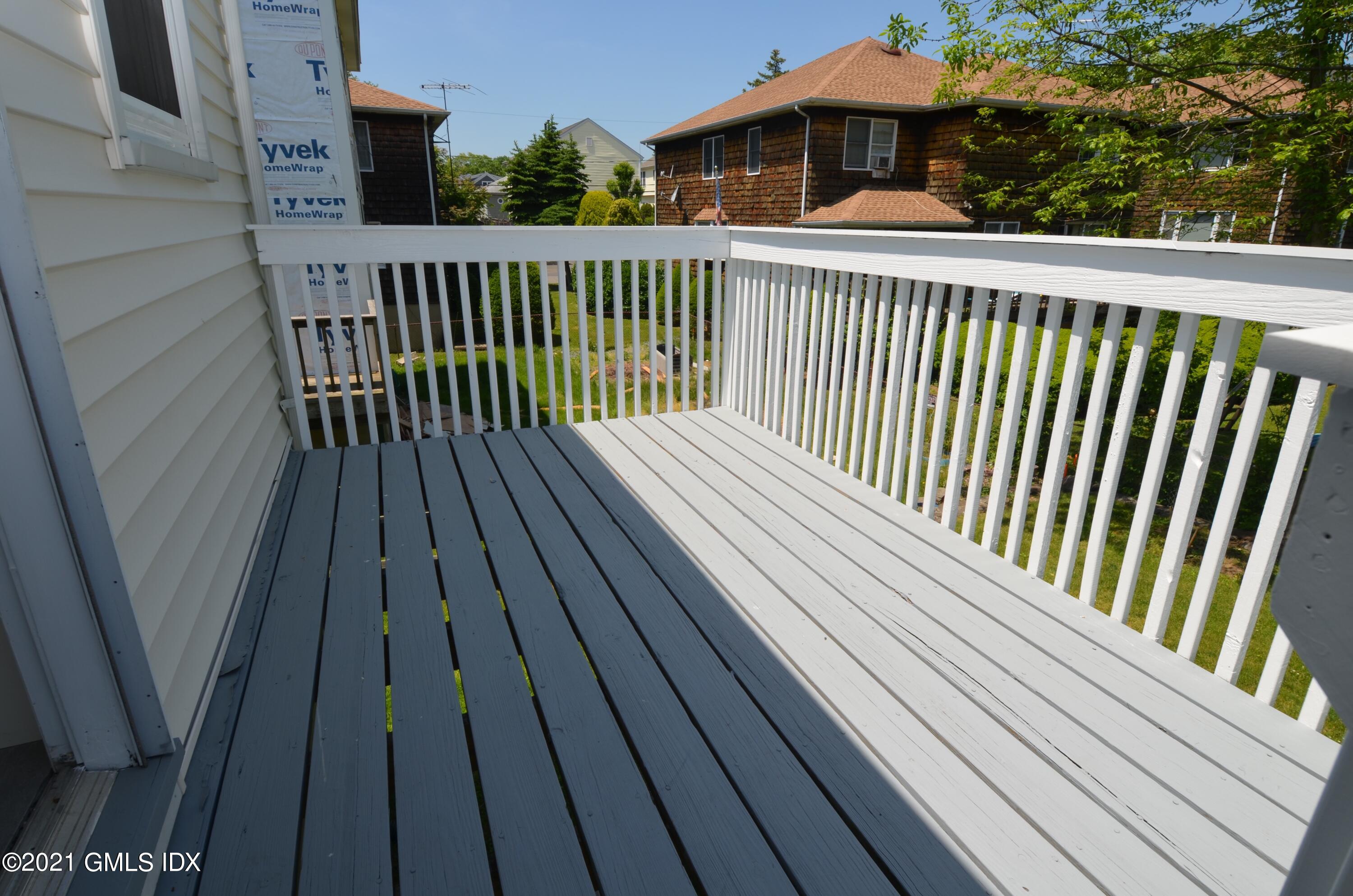5 Ridge Place, Unit 1 Greenwich, CT 06831 - Photo 23 of 29 a view of a wooden roof with balcony