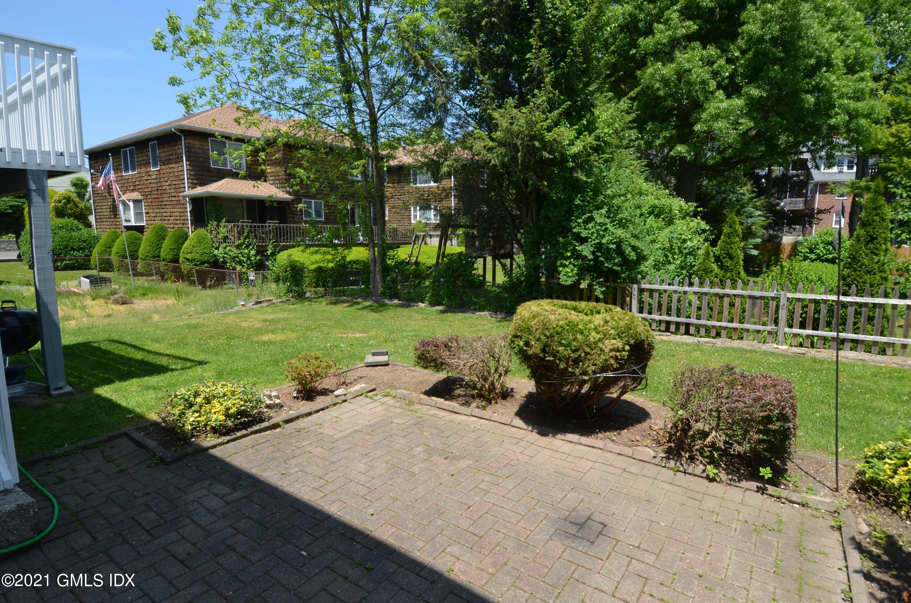 5 Ridge Place, Unit 1 Greenwich, CT 06831 - Photo 27 of 29 a view of a garden with a slide