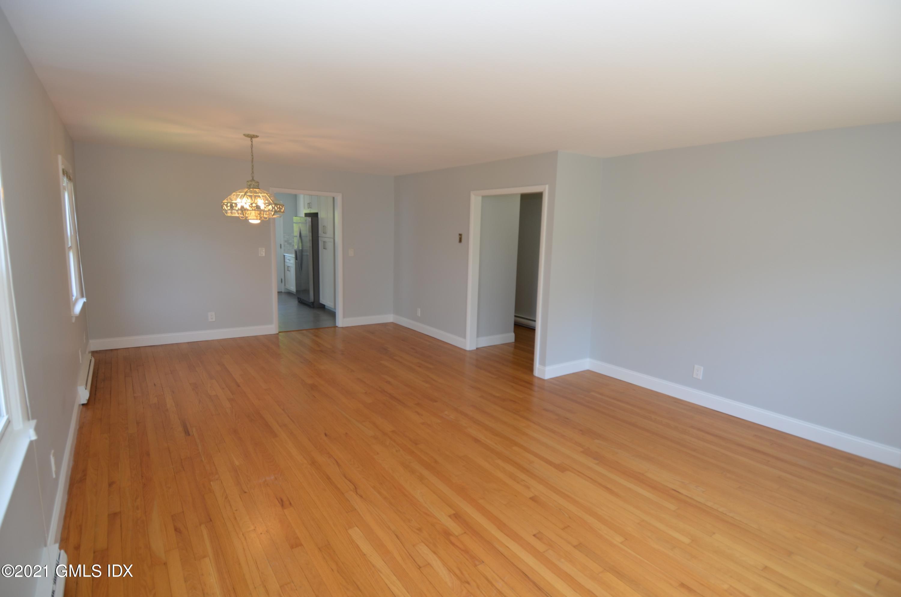 5 Ridge Place, Unit 1 Greenwich, CT 06831 - Photo 5 of 29 a view of a livingroom with wooden floor