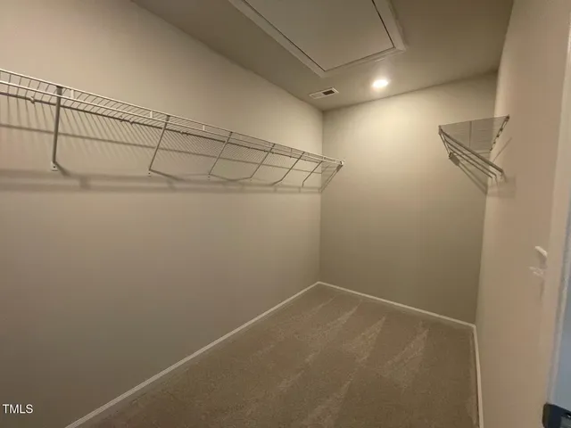 a view of a room with racks on the wall